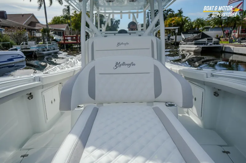 Slide: The Image of 2020 Yellowfin 32 Offshore boat interior with luxurious seating and waterfront view. - 34