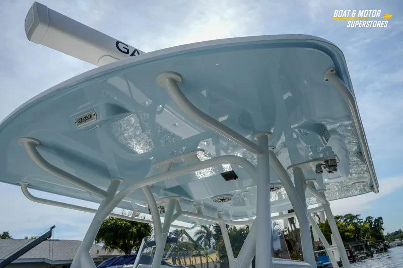 Slide: The Image of 2020 Yellowfin 32 Offshore boat with sleek T-top design and radar equipment. - 36