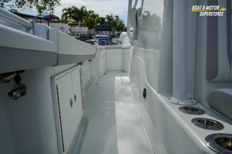 Slide: The Image of 2020 Yellowfin 32 Offshore boat interior with storage compartments and cup holders. - 43