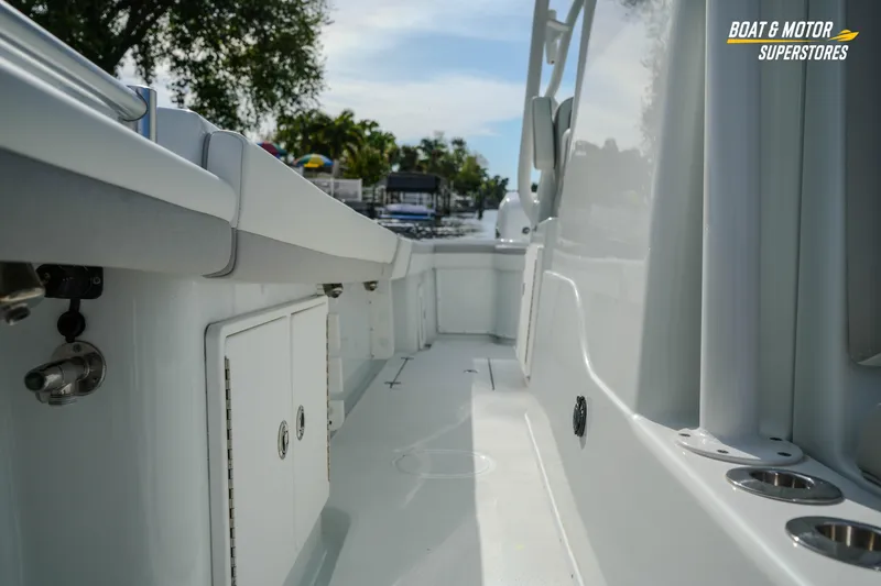 Slide: The Image of 2020 Yellowfin 32 Offshore boat interior with sleek white design and storage compartments. - 44