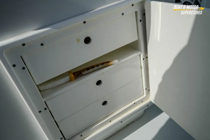 Slide: The Image of Storage compartment on a 2020 Yellowfin 32 Offshore boat with open drawers. - 49