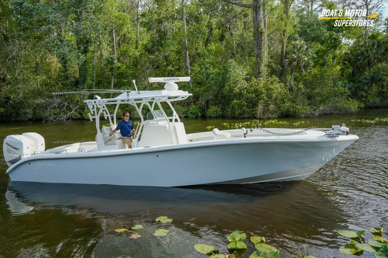 Slide: The Image of 2020 Yellowfin 32 Offshore boat cruising on a scenic river. - 52