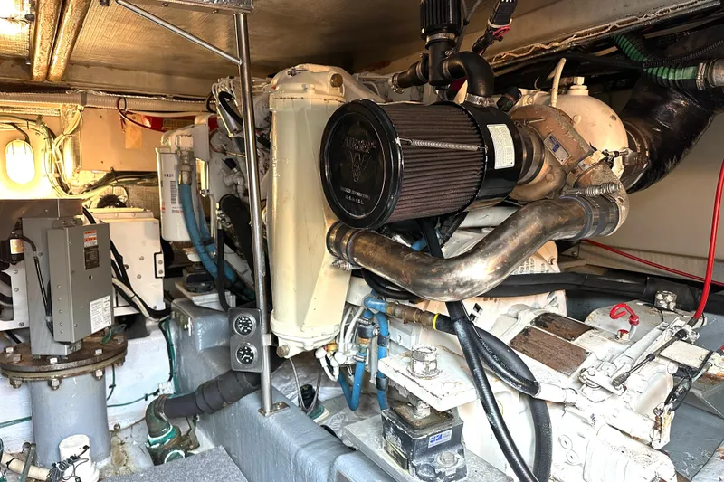 Slide: The Image of Engine room of a 2002 Skipjack 36 Flybridge boat, showcasing mechanical components. - 19