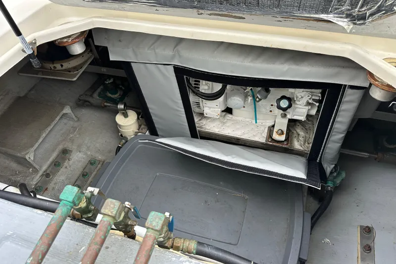 Slide: The Image of Engine compartment of 2002 Skipjack 36 Flybridge boat, showcasing mechanical components. - 23