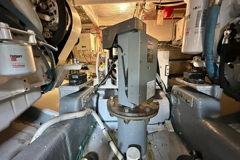 Slide: The Image of Engine room of 2002 Skipjack 36 Flybridge with mechanical components and wiring. - 24