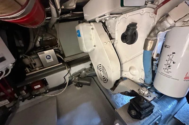 Slide: The Image of Engine room of a 2002 Skipjack 36 Flybridge boat, showcasing mechanical components. - 27