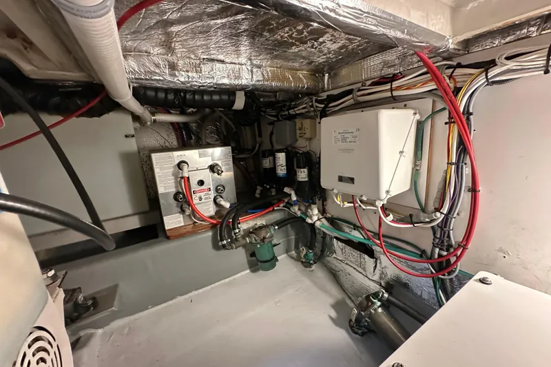 Slide: The Image of Engine room of 2002 Skipjack 36 Flybridge with wiring and equipment. - 28