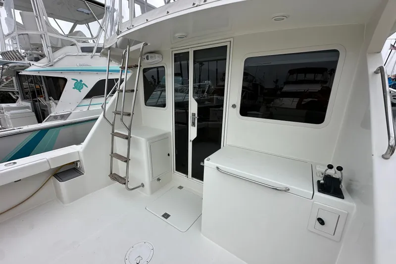 Slide: The Image of Flybridge boat deck with ladder, door, and window; Skipjack 36 Flybridge, 2002 model. - 31