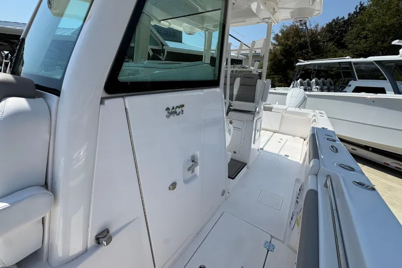 Slide: The Image of 2025 Caymas 34 CT boat interior, showcasing sleek design and modern seating arrangement. - 25
