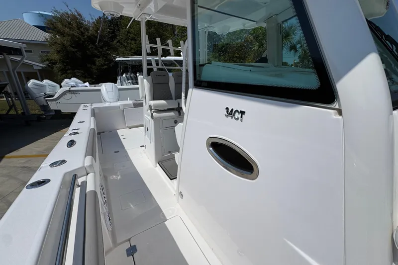 Slide: The Image of 2025 Caymas 34 CT boat deck with seating and storage compartments. - 26