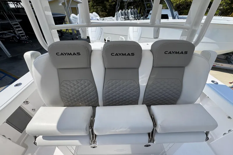Slide: The Image of 2025 Caymas 34 CT boat seats with gray and white upholstery, featuring diamond stitching. - 30