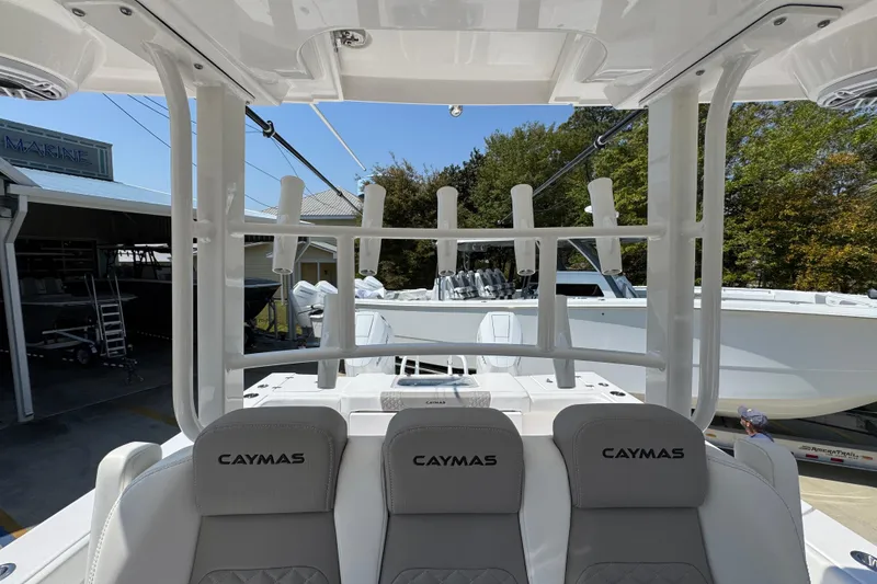 Slide: The Image of 2025 Caymas 34 CT boat interior with rod holders and seating. - 31
