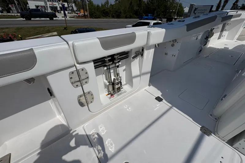 Slide: The Image of 2025 Caymas 34 CT boat deck with storage compartment and seating, showcasing modern design. - 37