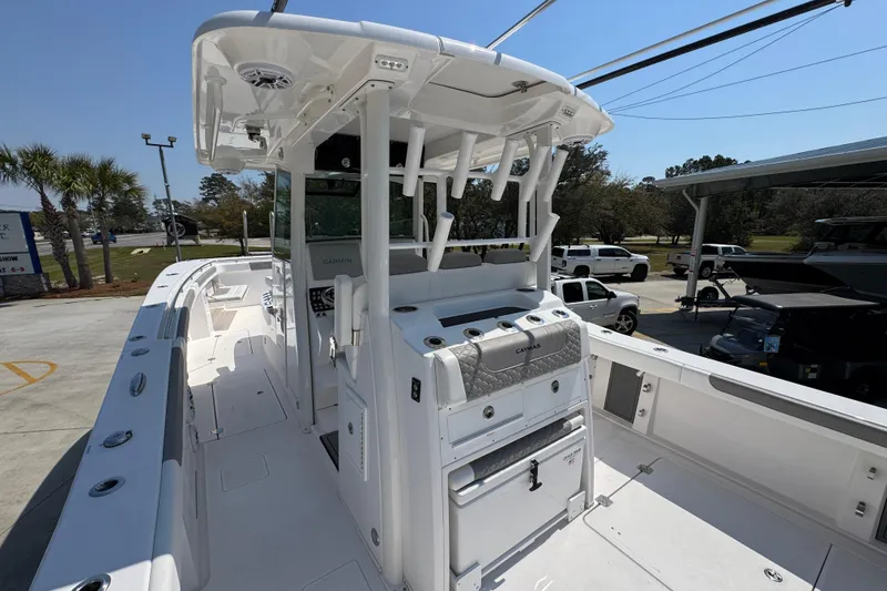 Slide: The Image of 2025 Caymas 34 CT boat with sleek design and modern features, docked outdoors. - 38