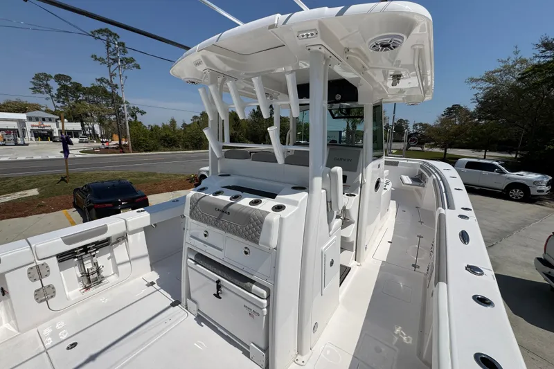 Slide: The Image of 2025 Caymas 34 CT boat with sleek white design and modern cockpit features. - 40