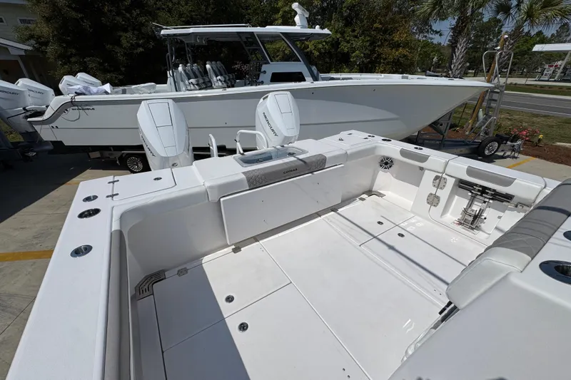 Slide: The Image of 2025 Caymas 34 CT boat with spacious deck and dual outboard engines. - 42