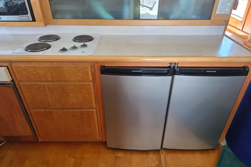 Slide: The Image of Compact kitchen with dual Frigidaire refrigerators and electric stovetop in a 1994 Navigator 5600. - 10