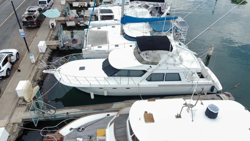 Slide: The Image of Aerial view of a 1994 Navigator 5600 yacht docked at a marina. - 2