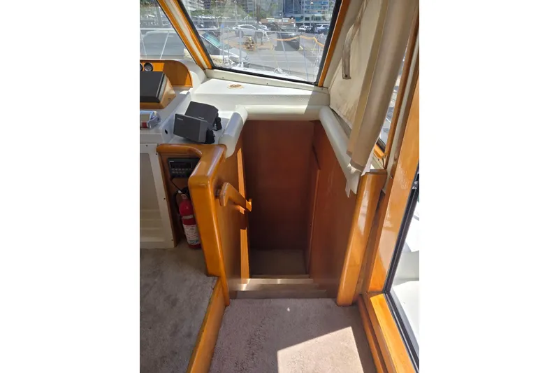 Slide: The Image of Interior of 1994 Navigator 5600 yacht showing stairs and helm area. - 29
