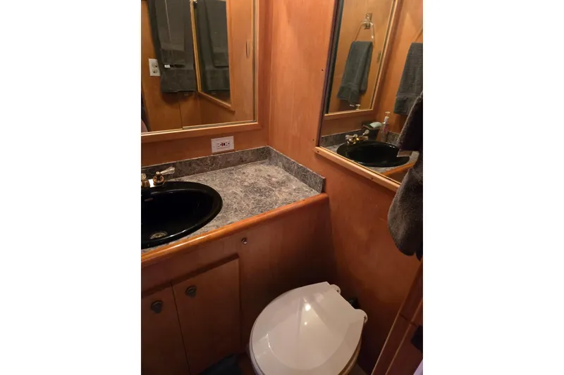 Slide: The Image of Bathroom interior of a 1994 Navigator 5600 with black sink and marble countertop. - 37