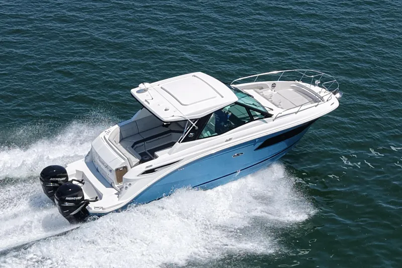 The Image of 2022 Sea Ray Sundancer 320 Coupe Outboard cruising on water. - 0
