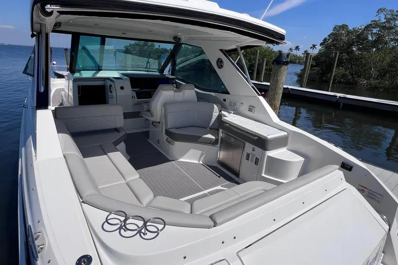 Slide: The Image of 2022 Sea Ray Sundancer 320 Coupe Outboard with spacious seating and modern amenities. - 13