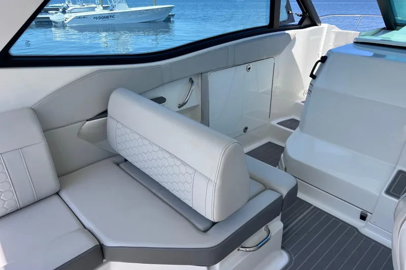 Slide: The Image of Interior of 2022 Sea Ray Sundancer 320 Coupe Outboard with sleek seating and modern design. - 20
