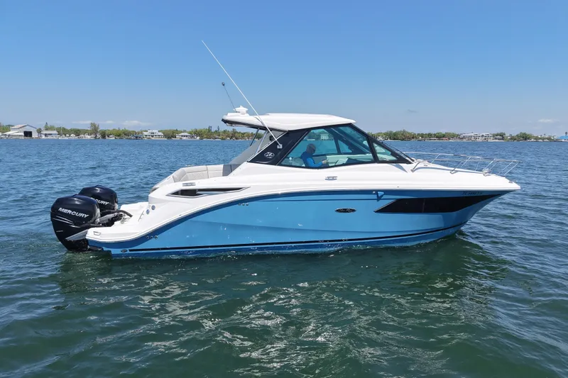 Slide: The Image of 2022 Sea Ray Sundancer 320 Coupe Outboard cruising on a sunny day. - 3