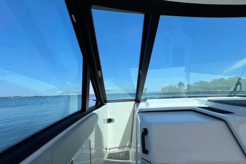 Slide: The Image of Interior view of 2022 Sea Ray Sundancer 320 Coupe Outboard with ocean backdrop. - 30
