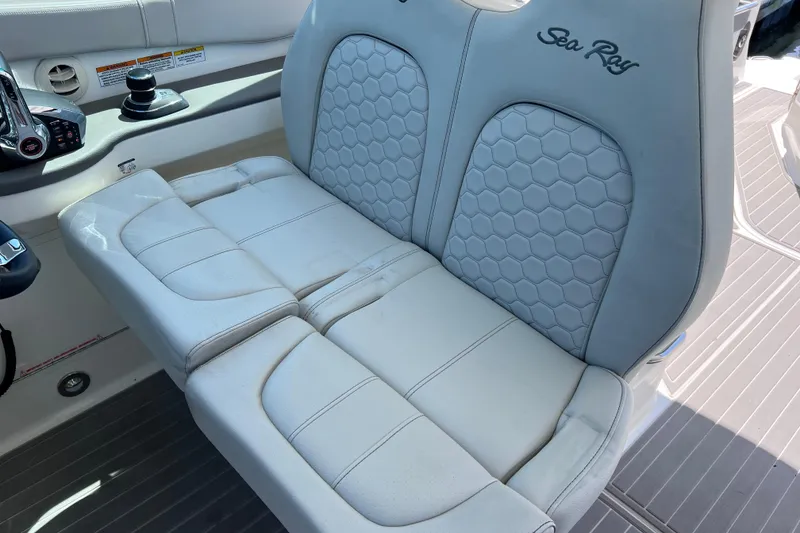 Slide: The Image of 2022 Sea Ray Sundancer 320 Coupe Outboard cockpit seating with hexagonal pattern upholstery. - 40