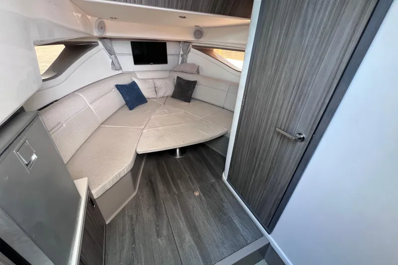Slide: The Image of 2022 Sea Ray Sundancer 320 Coupe Outboard cabin with modern seating and stylish decor. - 42