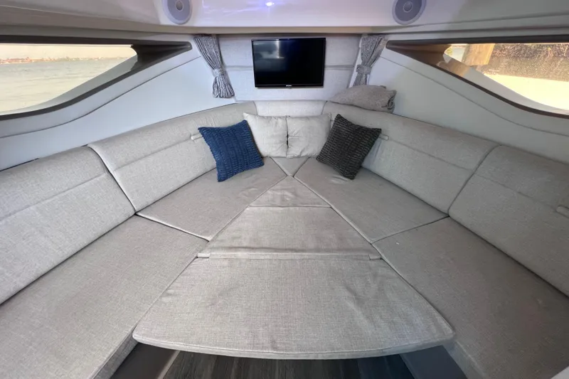 Slide: The Image of Interior of 2022 Sea Ray Sundancer 320 Coupe Outboard with cozy seating and cushions. - 43
