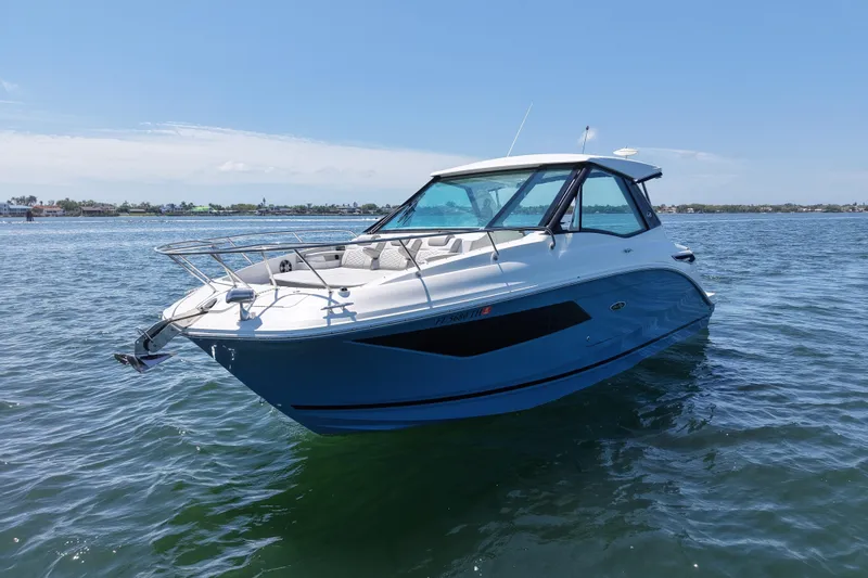 Slide: The Image of 2022 Sea Ray Sundancer 320 Coupe Outboard cruising on open water. - 6
