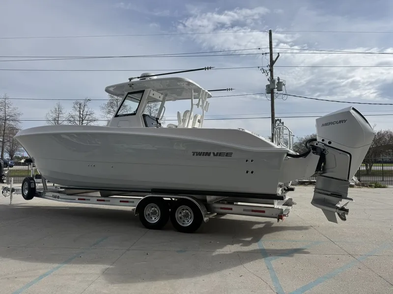 Slide: The Image of 2026 Twin Vee 280 GFX2 boat on trailer, side view. - 14