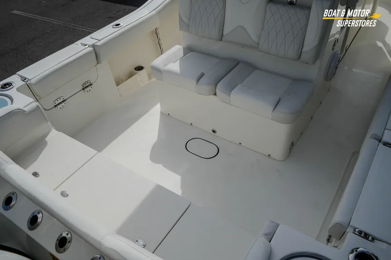 Slide: The Image of Interior view of 2026 Key West 291 FS boat, featuring spacious seating and storage. - 12