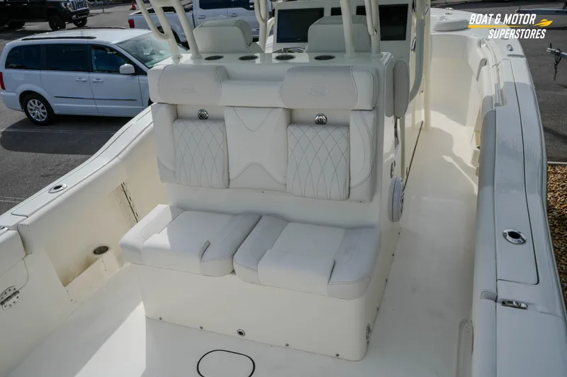 Slide: The Image of 2026 Key West 291 FS boat interior with white seating and modern design. - 15