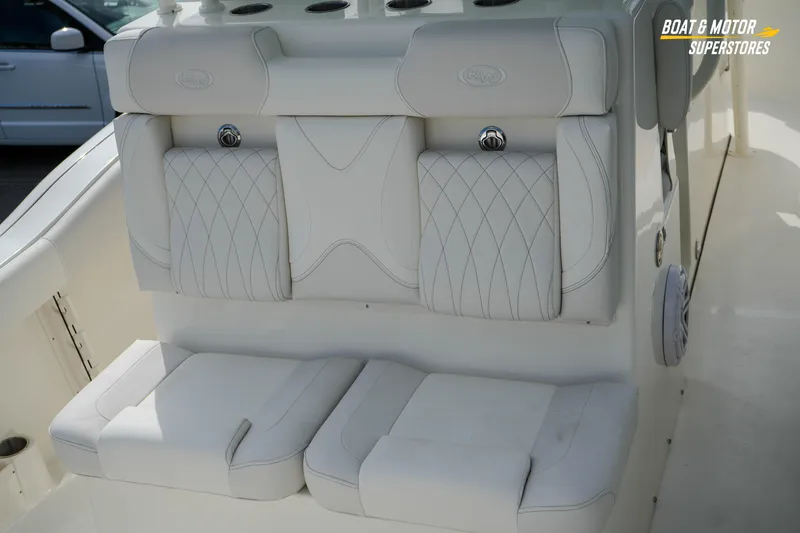Slide: The Image of 2026 Key West 291 FS boat interior with luxurious white seating and diamond stitching. - 16