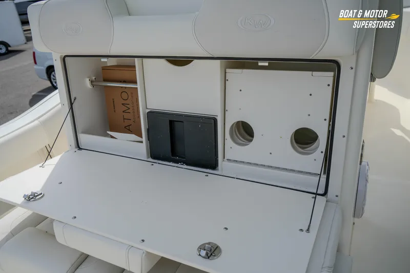Slide: The Image of 2026 Key West 291 FS boat storage compartment with open hatch and interior view. - 18