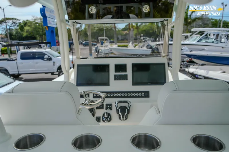 Slide: The Image of 2026 Key West 291 FS boat dashboard with modern controls and seating. - 19