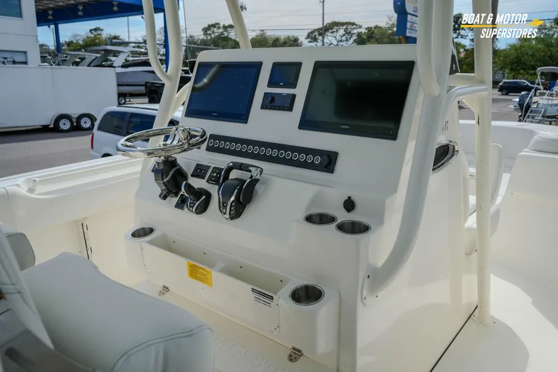 Slide: The Image of 2026 Key West 291 FS boat dashboard with modern controls and displays. - 22