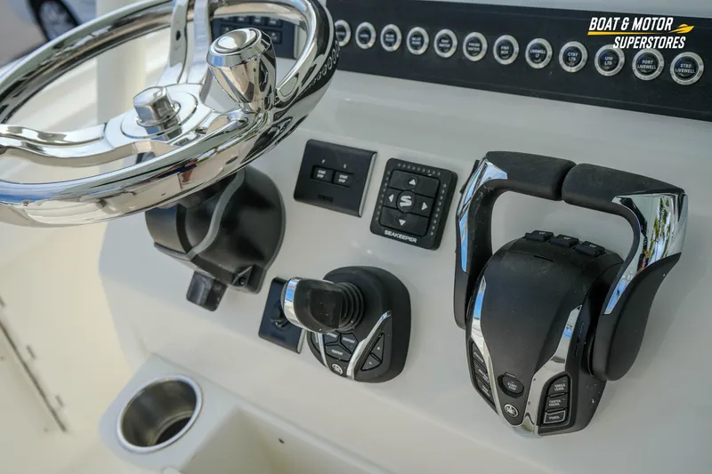 Slide: The Image of 2026 Key West 291 FS boat dashboard with steering wheel and controls. - 25