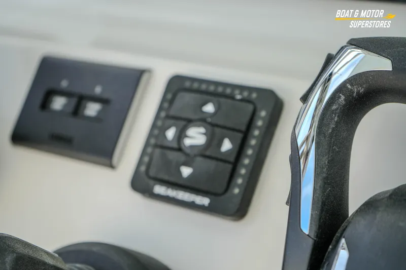 Slide: The Image of Close-up of 2026 Key West 291 FS boat controls and throttle handle. - 27