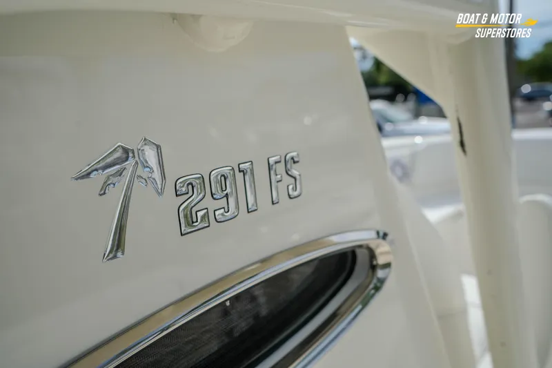 Slide: The Image of 2026 Key West 291 FS boat emblem close-up in sunlight. - 29