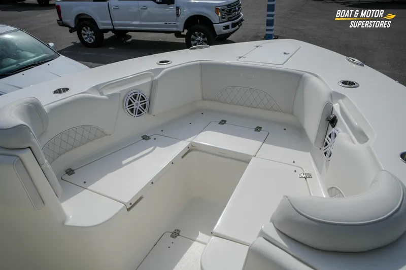 Slide: The Image of 2026 Key West 291 FS boat interior with white seating and storage compartments. - 31