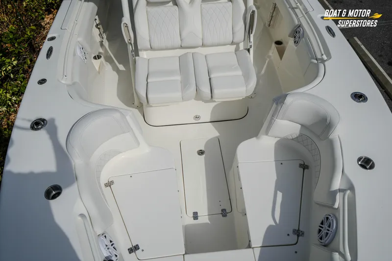 Slide: The Image of 2026 Key West 291 FS boat interior with white seating and storage compartments. - 32