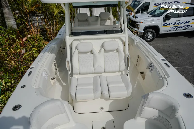 Slide: The Image of 2026 Key West 291 FS boat interior with white seating and console. - 33