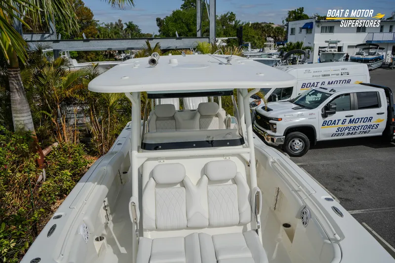 Slide: The Image of 2026 Key West 291 FS boat at dealership, featuring spacious seating and modern design. - 34