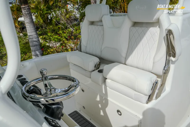 Slide: The Image of Luxury seating and steering wheel of 2026 Key West 291 FS boat. - 38