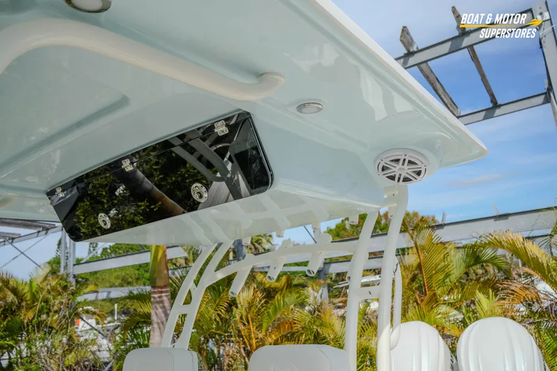 Slide: The Image of 2026 Key West 291 FS boat canopy with speaker and storage compartment. - 39