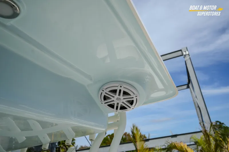 Slide: The Image of 2026 Key West 291 FS boat speaker and canopy detail under blue sky. - 40